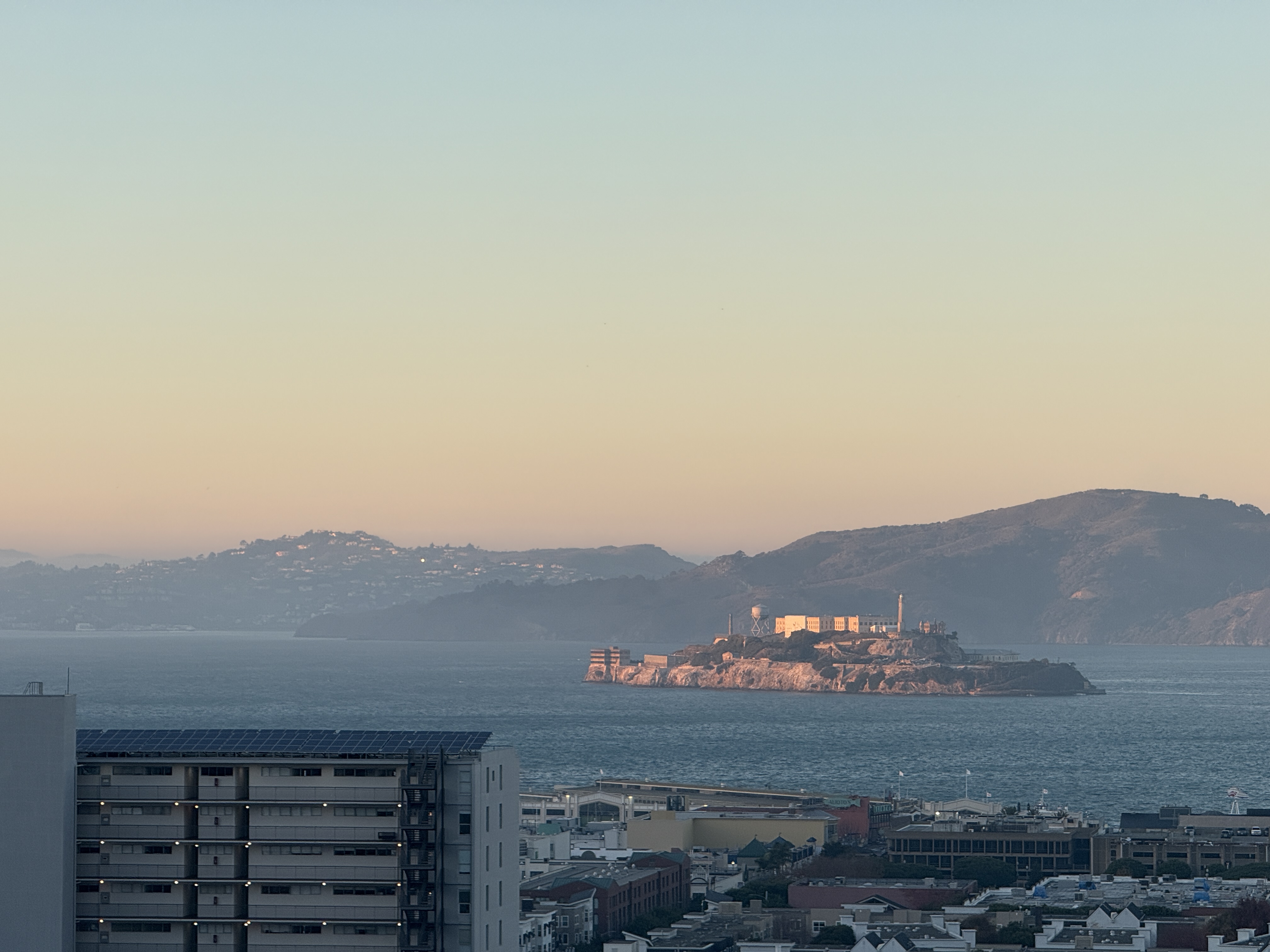 Alcatraz lit up by the setting sun